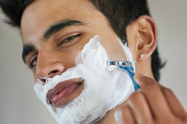 man shaving with best men's shave cream, urth
