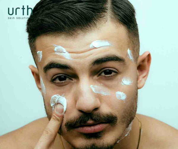 handsome man applying urth men's face moisturizer 