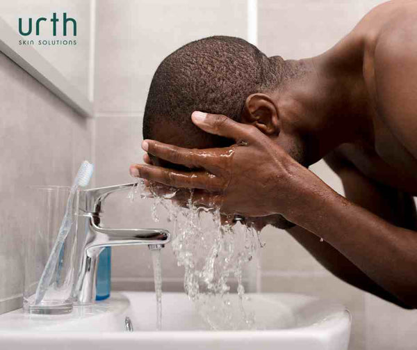 black man washing face with urth men's face wash for 60 second cleansing rule men's skincare