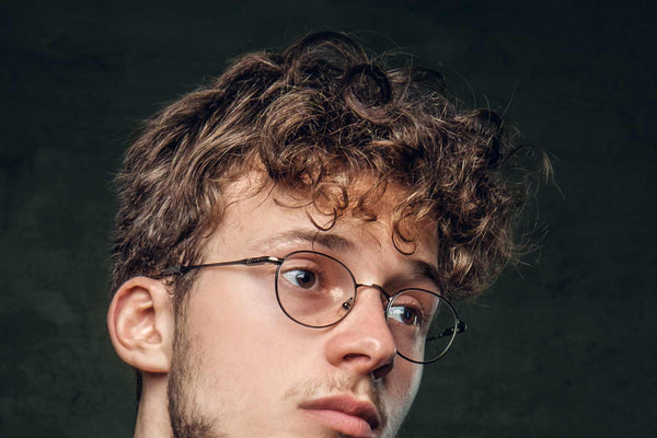 man with wavy hair, urth