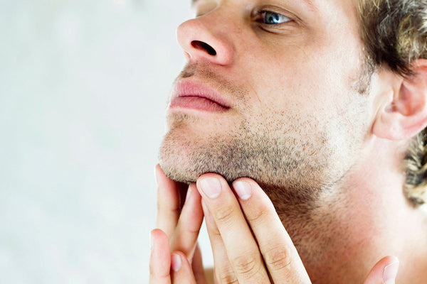 man with facial hair and clear skin 