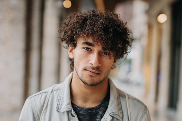 A 30 something male urth customer with curly hair