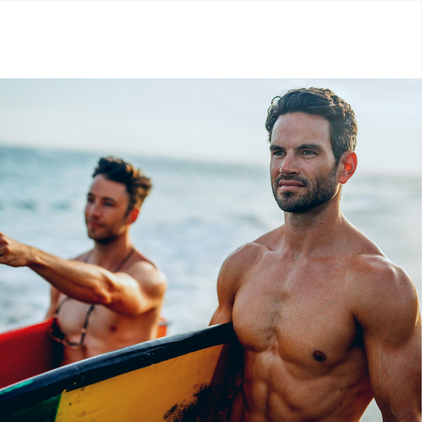 two fit and tan men with surfboards under right arms, URTH