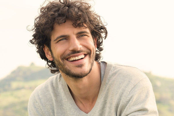 man with wavy hair after using sea salt spray