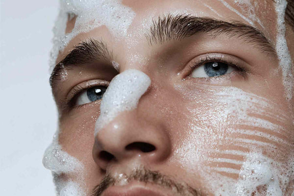 man using urth's natural face wash 