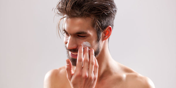 Skincare Routine: Man Applying Moisturizer to Face