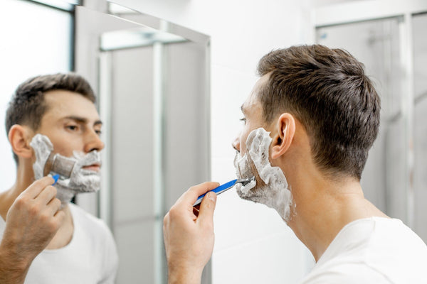 man shaving with best men's shave cream, urth