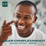 HANDSOME BLACK YOUNG MAN USING URTH'S MEN'S SKINCARE KIT